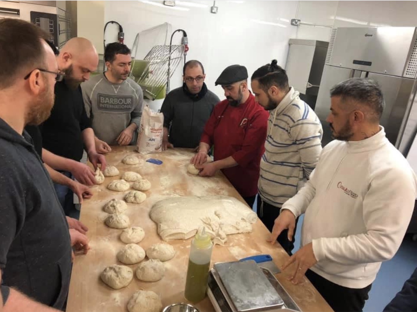 Ralph Carlone teaching a pizza dough making class