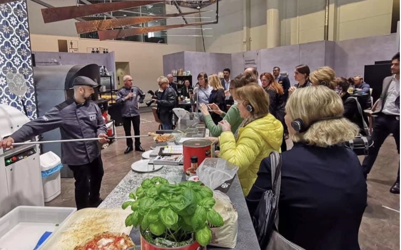Ralph Carlone conducting a live pizza demonstration